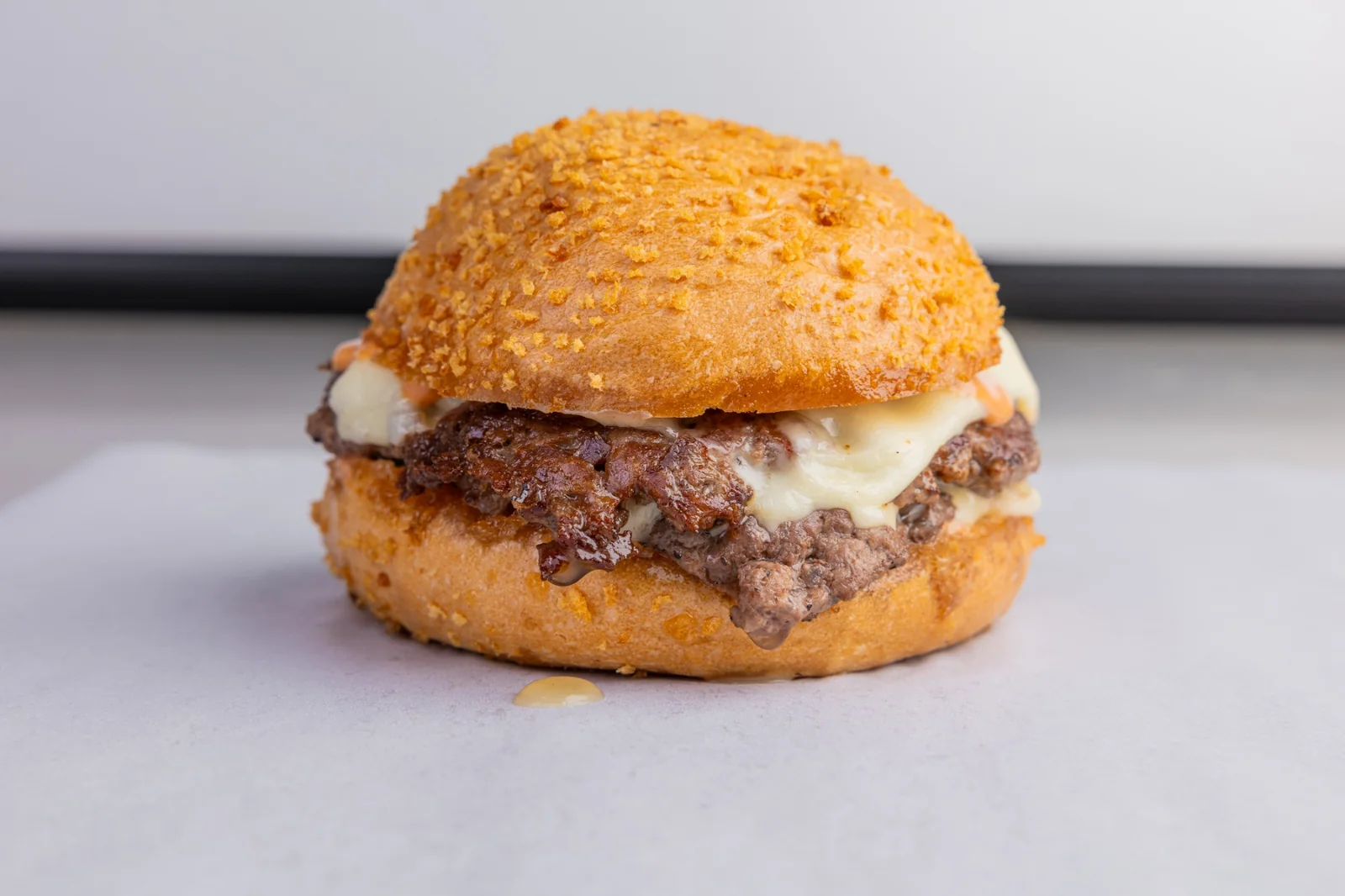 Double smashburger with White American Cheese and Panda Sauce on toasted Pandasal